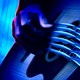 close-up of hand playing guitar in blue color