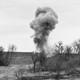 Cloud of dust and debris from an explosive