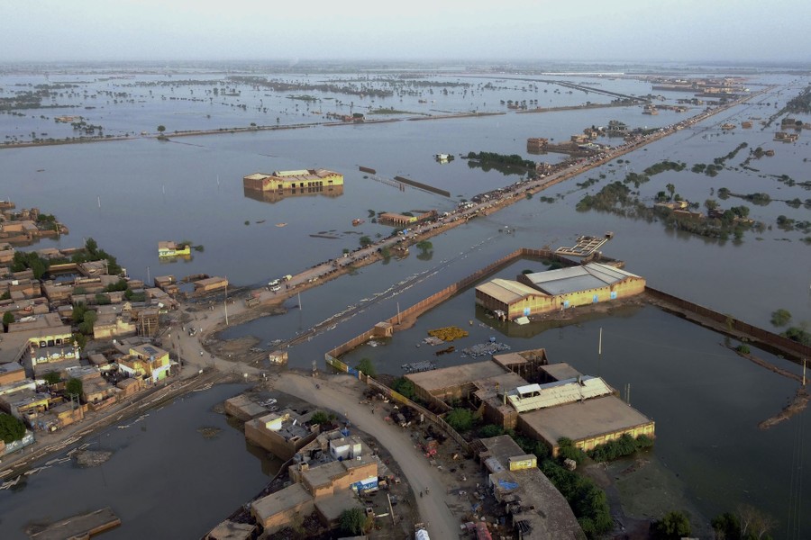 An aerial view of houses and fields swamped by floodwater