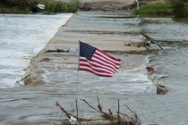 american flag by the river in Kerr County
