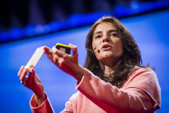 Neuroscientist Suzana Herculano-Houzel holds up a tube that contains a liquid suspension of all the cell nuclei that once made up a mouse brain.