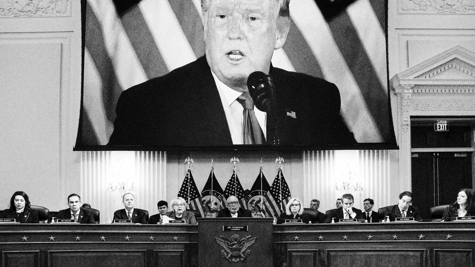 January 6 committee with Donald Trump on a projector screen