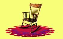 An image of an empty rocking chair with a covid particle underneath