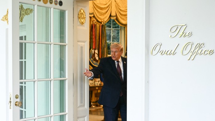 Donald Trump entering the Oval Office