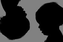 Silhouettes of babies' heads, one of which is upside down