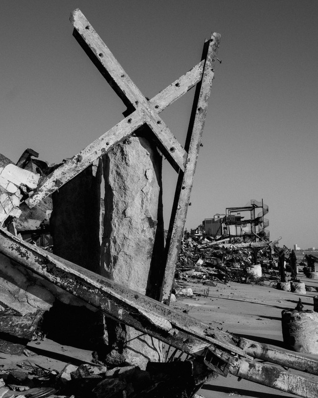 Black-and-white photograph of a burned home in Los Angeles