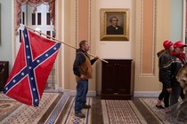 A Confederate flag-toting man in the Capitol during the January 6th insurrection