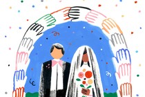 A bride and groom stand under an arch made of hands holding each other