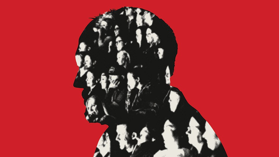 Louis C.K. in profile against a red backdrop