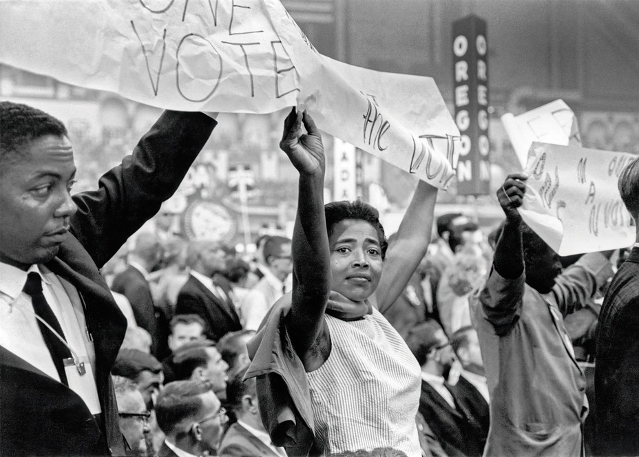 Mississippi Freedom Democratic Party delegates hold up VOTE banner, 1964 DNC