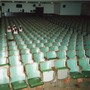 four Black students sit an empty lecture hall
