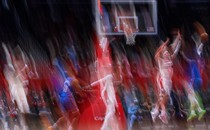 An intentionally blurry image of Washington Wizards players in motion mid-game