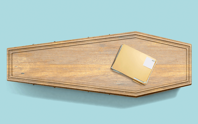 A coffin with a folder of papers on top