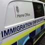 A British government Home Office van is seen with the words "immigration enforcement" along its side.