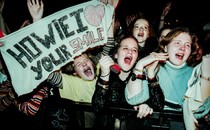 Photo of young fans screaming for the Backstreet Boys at a show in 1996