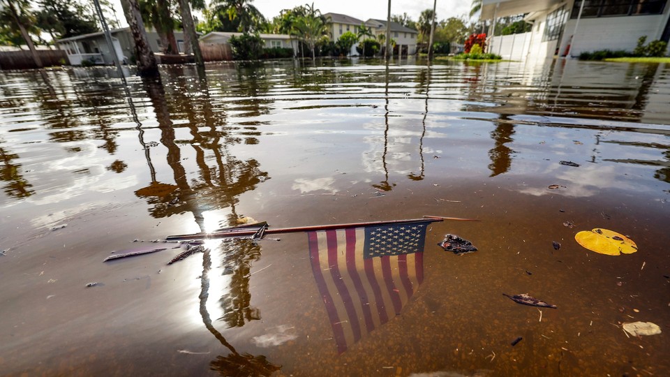 An American flag is submerged in floodwaters in Florida after Hurricane Helene swept over the southeastern United States.