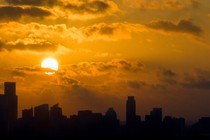 The sun rises over downtown Austin, Texas, on Friday, June 30, 2023.