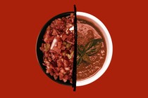 A bowl is full of salsa on the left side and gazpacho on the right, divided by a black line.