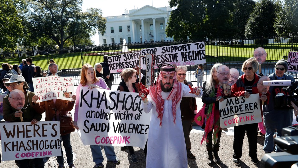 Demonstrators call for sanctions against Saudi Arabia outside the White House on October 19, 2018.