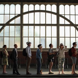 Photo of commuters standing in line