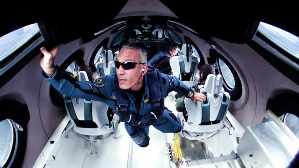 A passenger floats in weightlessness on a Virgin Galactic flight to the edge of space