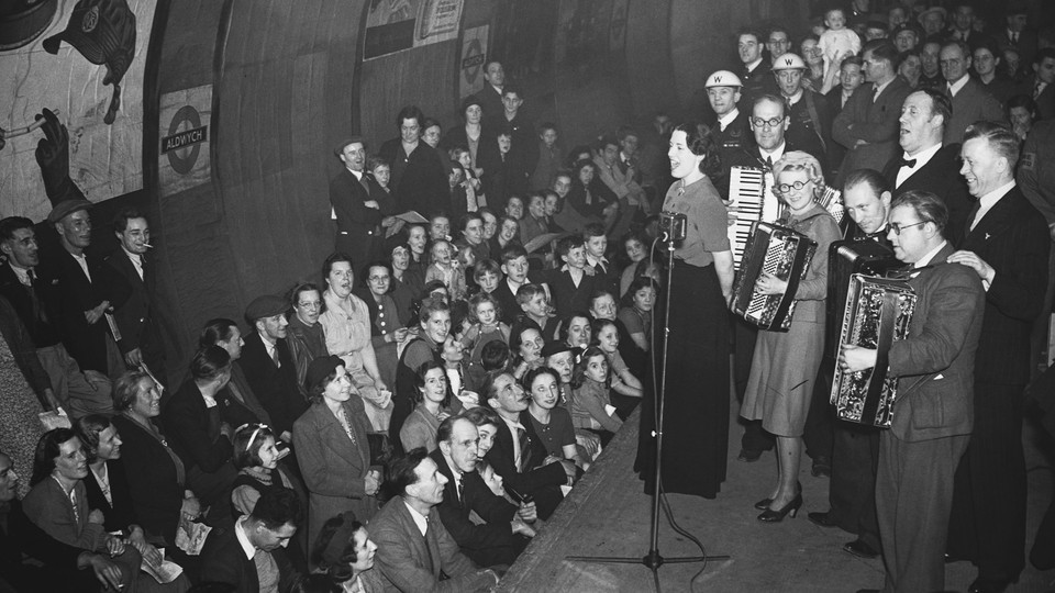 Londoners shelter and listen to music during the German bombings of World War II.