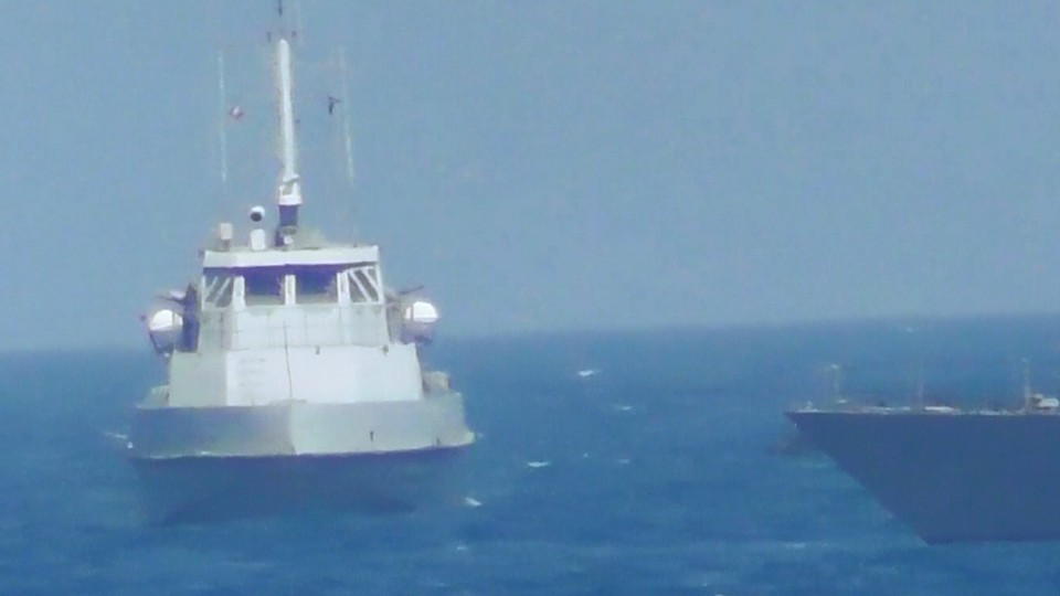 An Iranian vessel steers close to the USS Thunderbolt on July 25, 2017. 