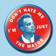 A pin showing Chicago Mayor Lori Lightfoot's face surrounded by the words "Don't hate me I'm just the mayor"