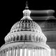 The Capitol is shown in black-and-white, with its blurry, shifted mirror image superimposed.