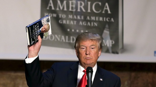 Donald Trump holding a book