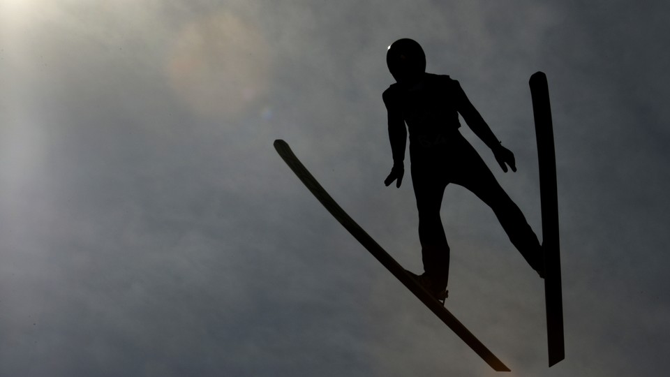 An Olympic skiier practices.