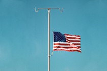 Illustration: American flag at half-mast on an IV stand