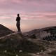 An image of a man standing in front of a highway