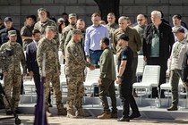 General Zaluzhny and President Zelensky shake hands.