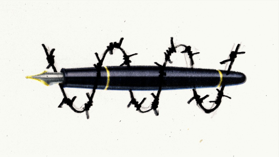A pen surrounded by barbed wire