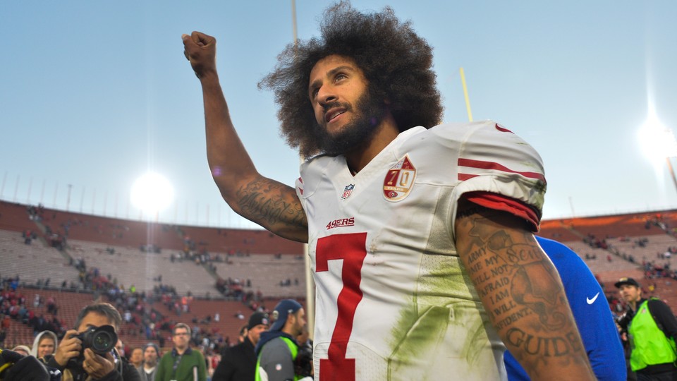 Colin Kaepernick raises a fist after a 49ers win in December 2016