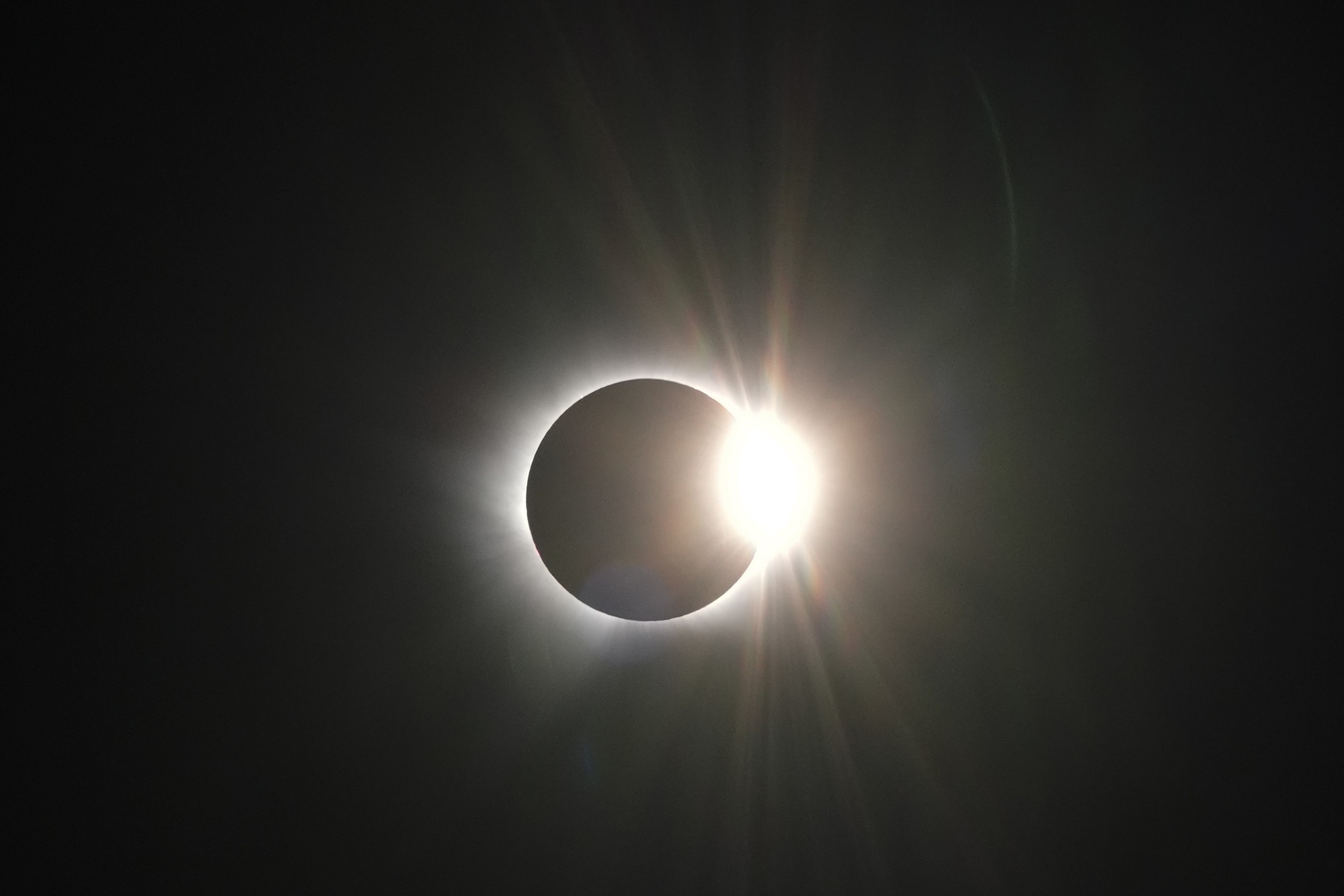 The sun, almost completely obscured by the moon.