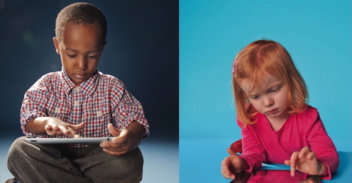 Kids with gadgets. little children holding and playing with