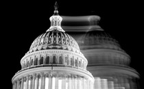 The Capitol is shown in black-and-white, with its blurry, shifted mirror image superimposed.