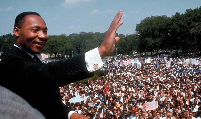 MLK waves to crowd