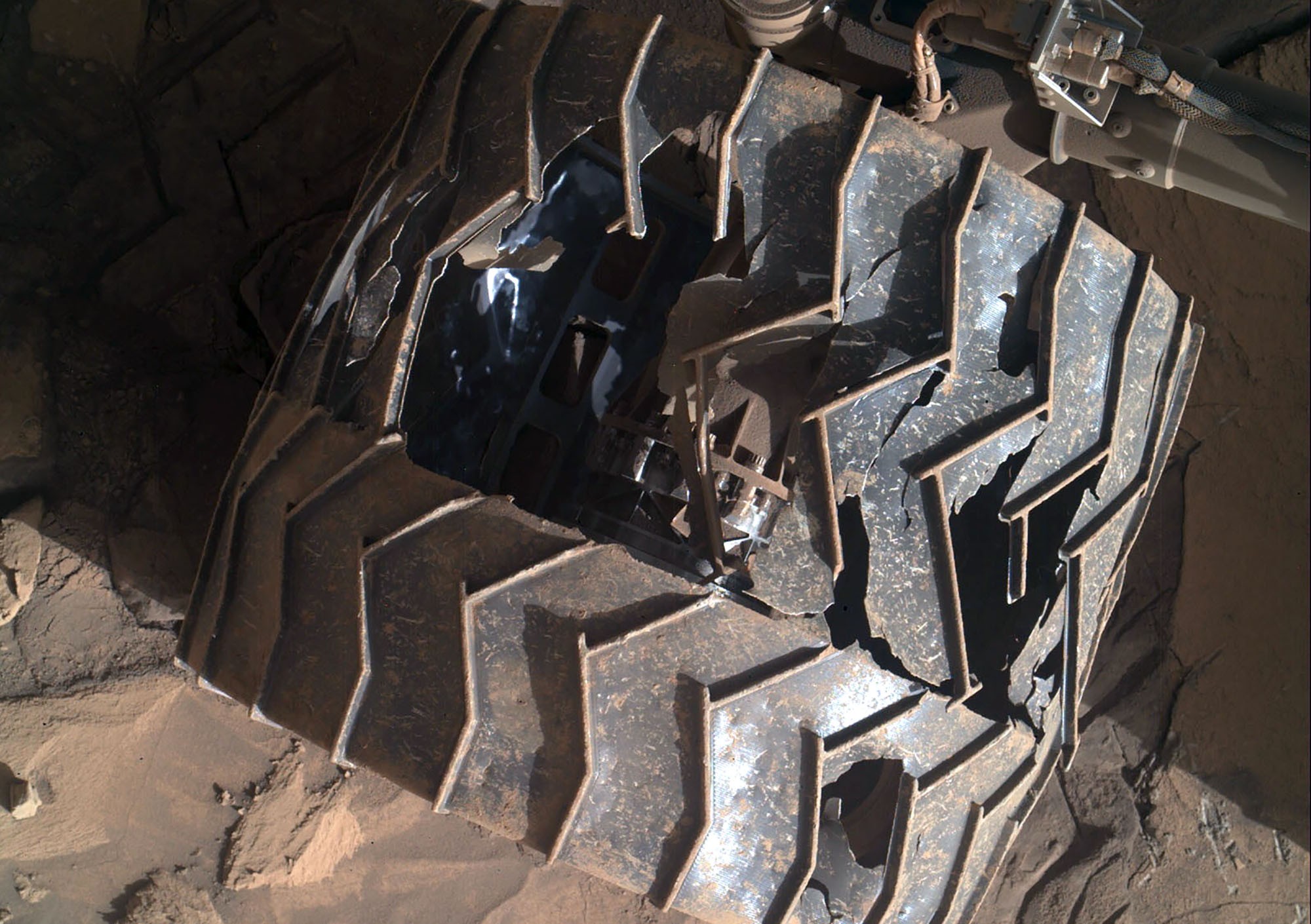A slightly-damaged wheel of a Mars rover