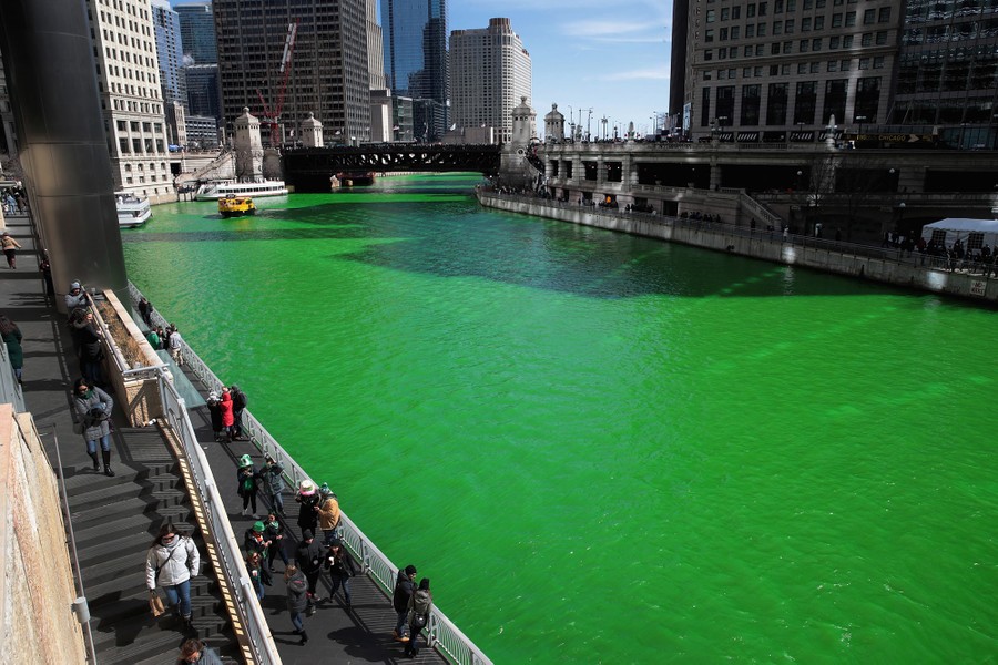 Visitors look over the Chicago River shortly after it was dyed green in celebration of St. Patrick's Day on March 11, 2017 in Chicago, Illinois.