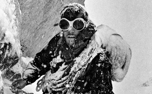 Photo of Douglas Tompkins climbing in snow, 1968