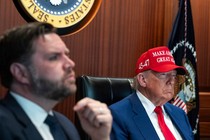 President Donald Trump, wearing a red hat, and Vice President J. D. Vance sit in the Situation Room at the White House.