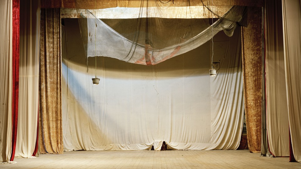 An image of an empty stage at a theatre