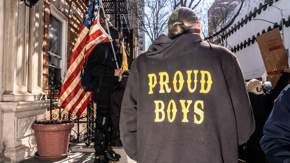 An image of a man wearing a Proud Boys hoodie