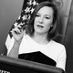 Jen Psaki speaking from a White House podium