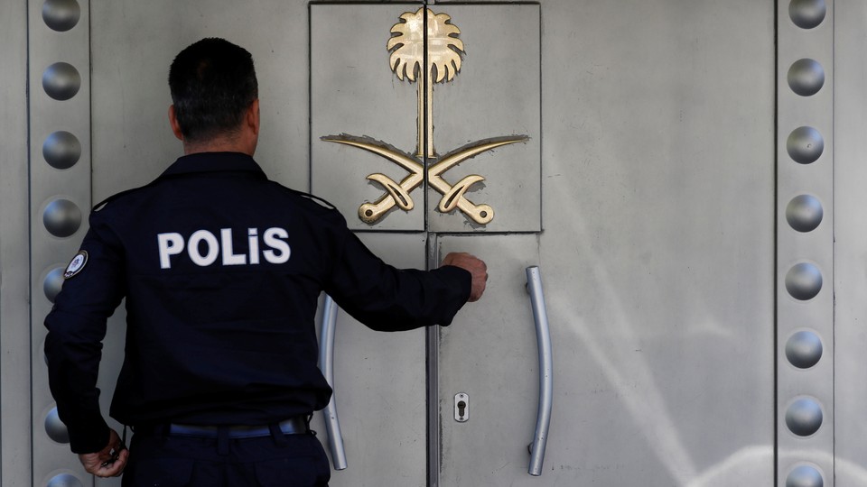 A Turkish police officer stands guard at Saudi Arabia's consulate in Istanbul.