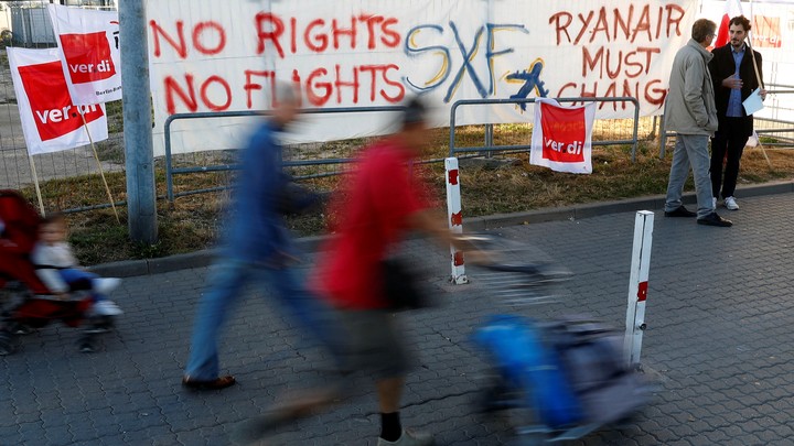 Union banners hang outside the Schönefeld Airport near Berlin as Ryanair employees stage a 24-hour strike on September 12.