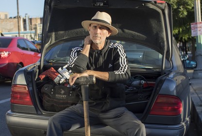 Charlie Santore sits on his trunk full of safecracking equipment